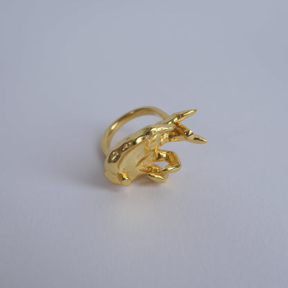 Unique gold ring with hand facing up